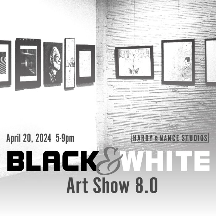 black and white art on a gallery wall